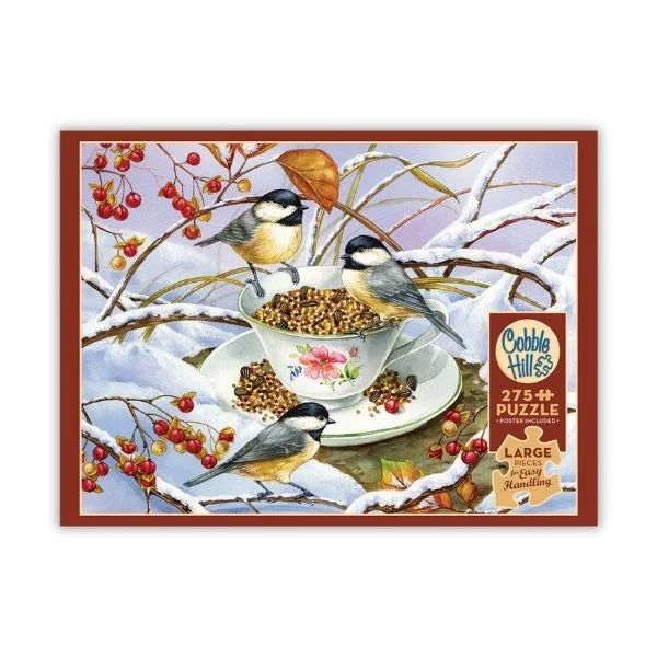 Cobble Hill puzzle box with birds around a teacup and saucer on a snowy branch design.