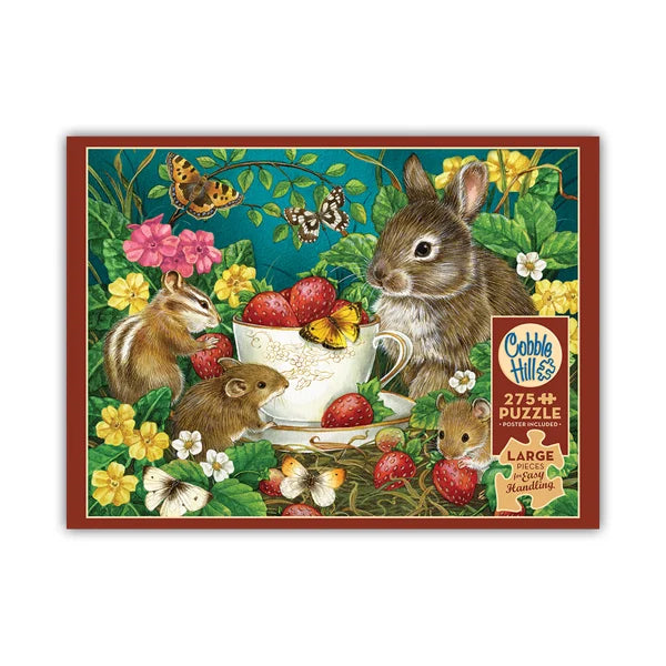Jigsaw puzzle box with animals and flowers around a teacup
