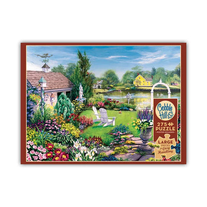 Cobble Hill puzzle box with a garden scene beside a lake