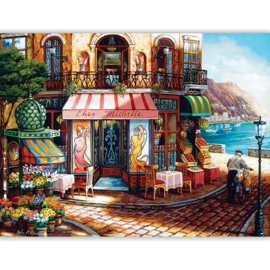 Colorful Italian street scene with a cafe and flowers by the water