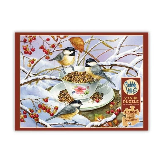 Cobble Hill puzzle box with birds around a teacup and saucer on a snowy branch design.