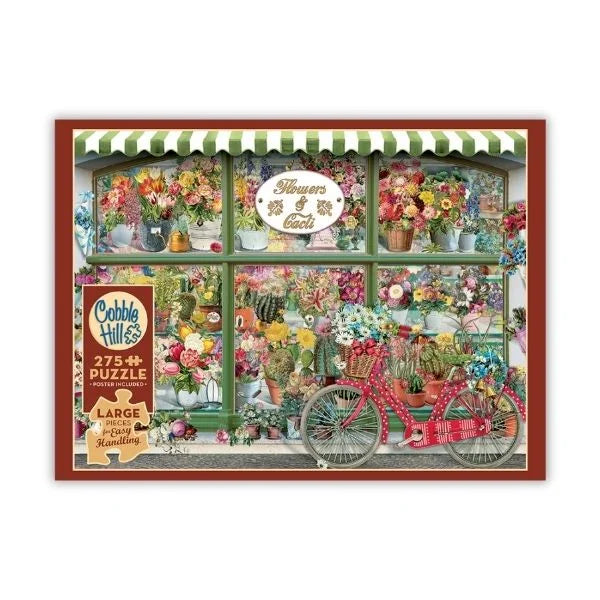 Floral puzzle box with a bicycle and flowers, featuring the brand 'Cobble Hill'.