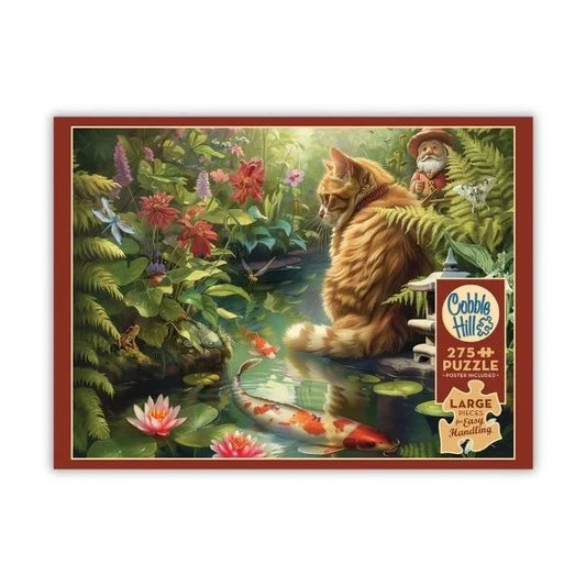 Cobble Hill puzzle box with a cat and fish scene on a white background