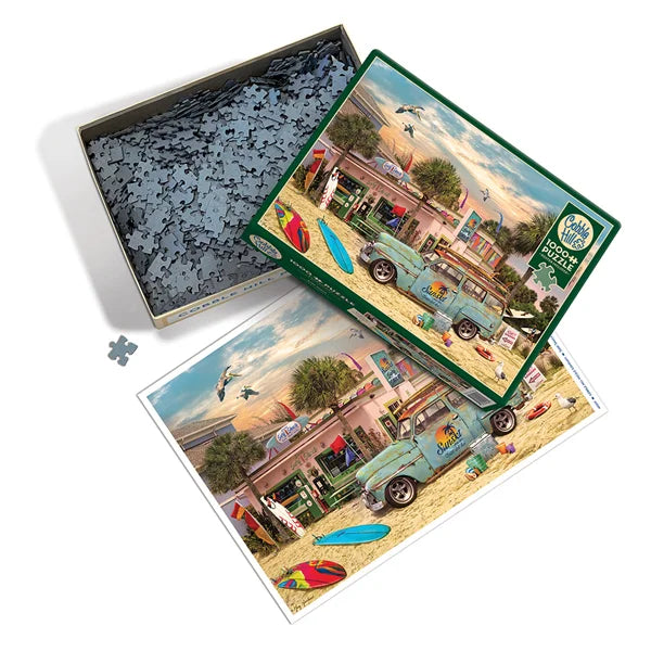 Top view of the Cobble Hill Surf Shack 1000 Piece Jigsaw Puzzle, Poster and Box