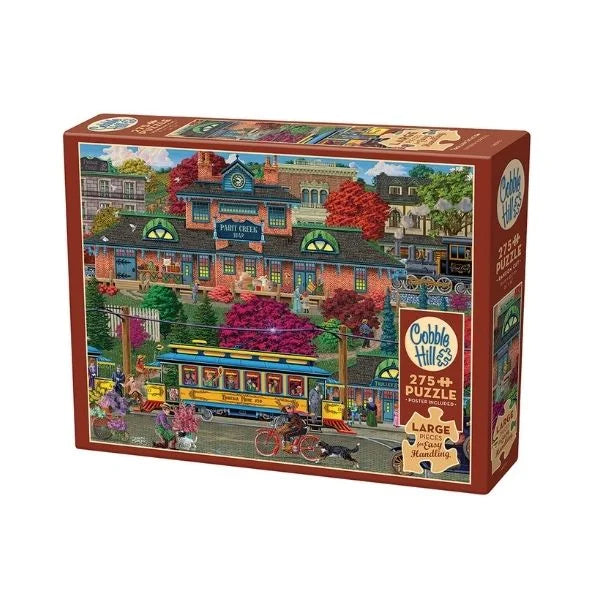 Cobble Hill puzzle box featuring a colorful illustration of a town scene on the cover.
