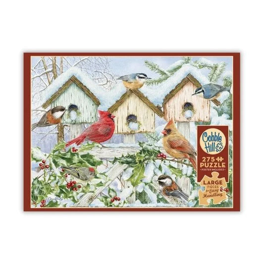 Cobble Hill puzzle featuring a winter scene featuring birds and birdhouses.