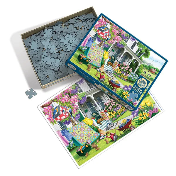 Top view of the Cobble Hill Spring Cleaning 500 Piece Jigsaw Puzzle, Poster and Box